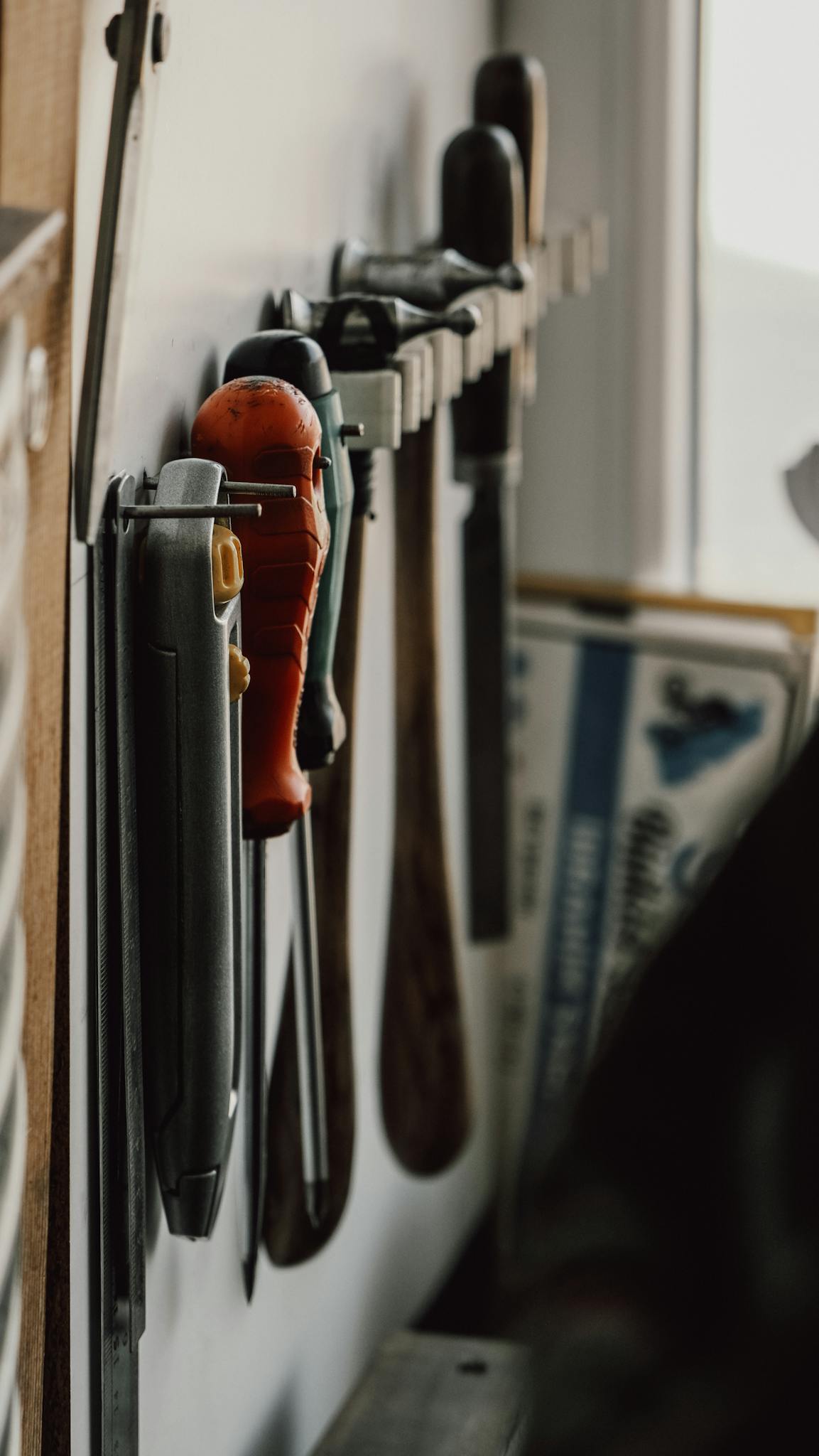 Close-up view of hand tools neatly arranged in a workshop setting, highlighting craftsmanship.